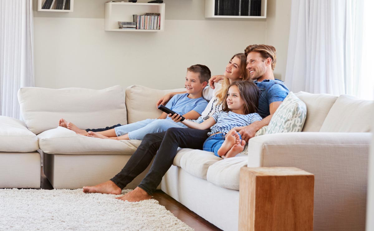 Family on Couch: Healthy Indoor Air in Pensacola, FL | All Seasons Service Network